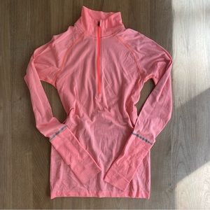 bright orange lululemon quarter zip - perfect for running and gym!